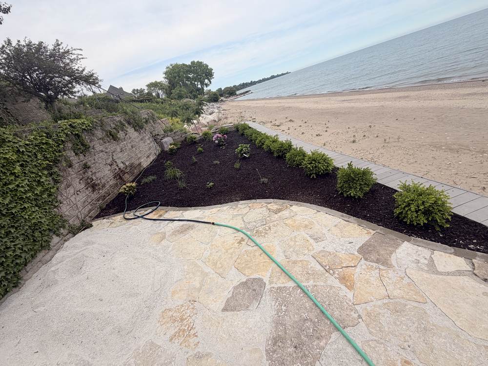 Mulch beds and paver edging by J&D ProMaster Landscaping